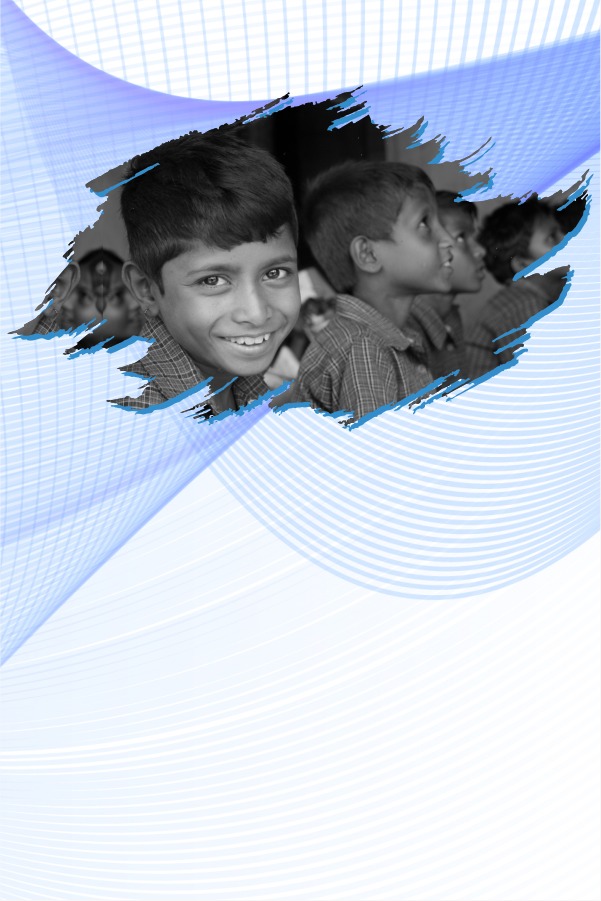A boy smiling in a classroom